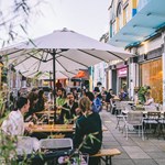 People dining outside at Terrace Goods in Orchard Square