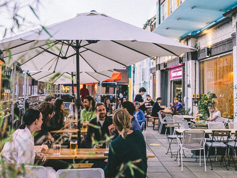 People dining outside at Terrace Goods in Orchard Square
