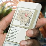 A close of a hand holding a phone.