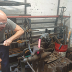 Two men hard at work in a forge.