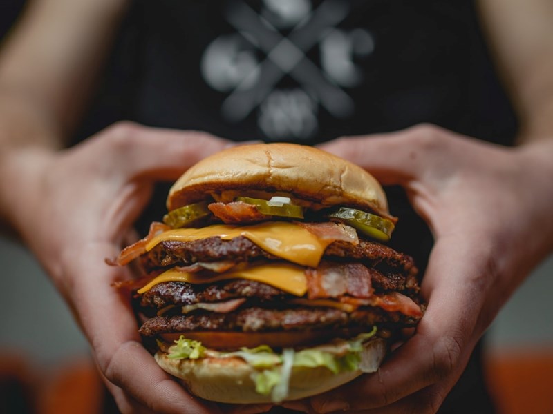 A triple-patty cheeseburger.