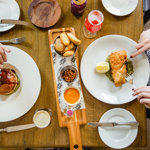 An overhead shot of people eating a meal at The Cricket Inn.