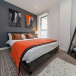 Modern bedroom with a double bed.