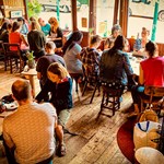 The interior of Cafe #9 filled with customers.