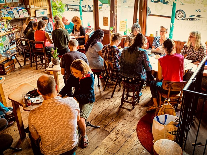 The interior of Cafe #9 filled with customers.