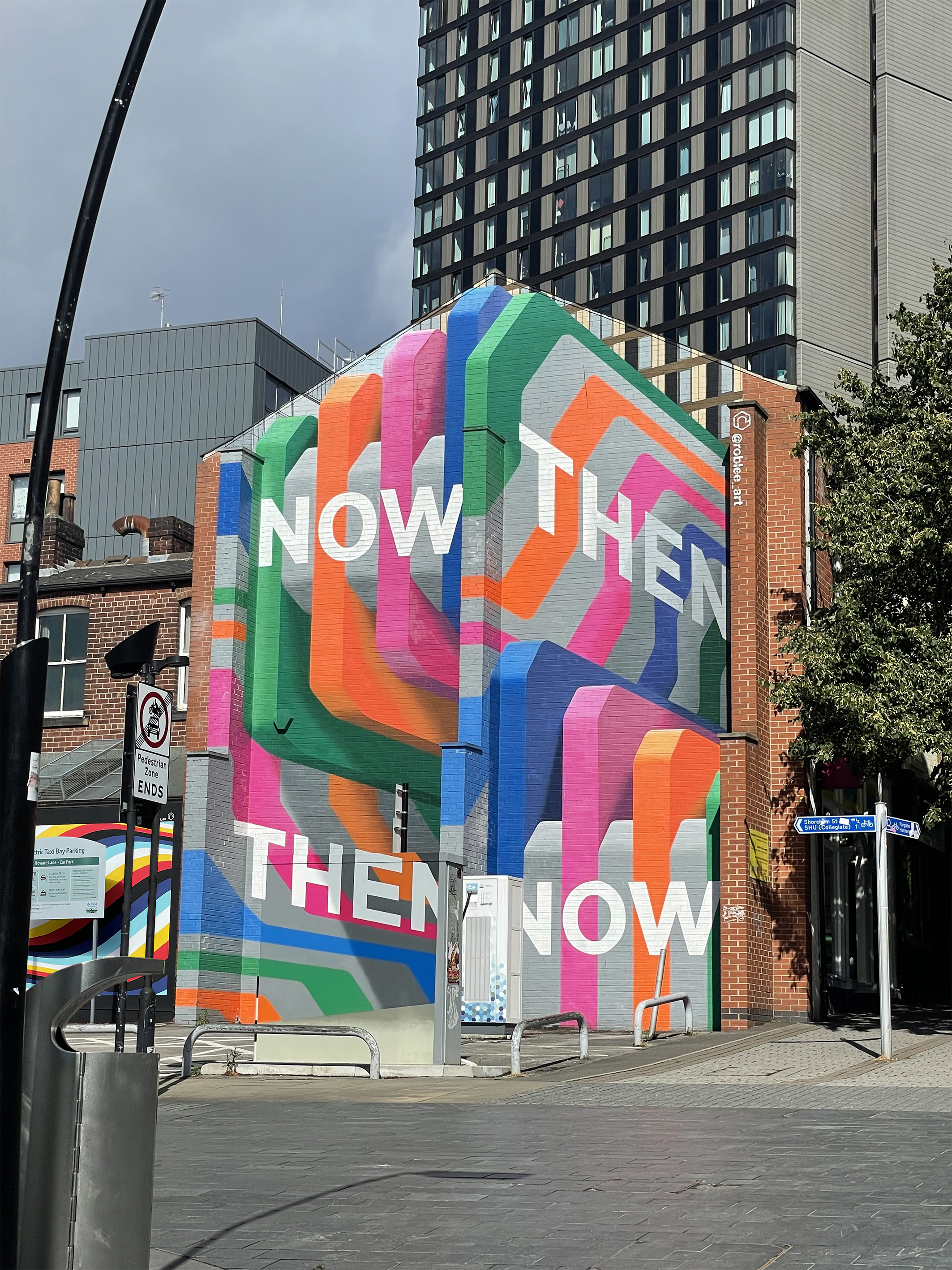 Artist Rob Lee's colourful mural Now Then, Then Now visible from Howard Street in Sheffield
