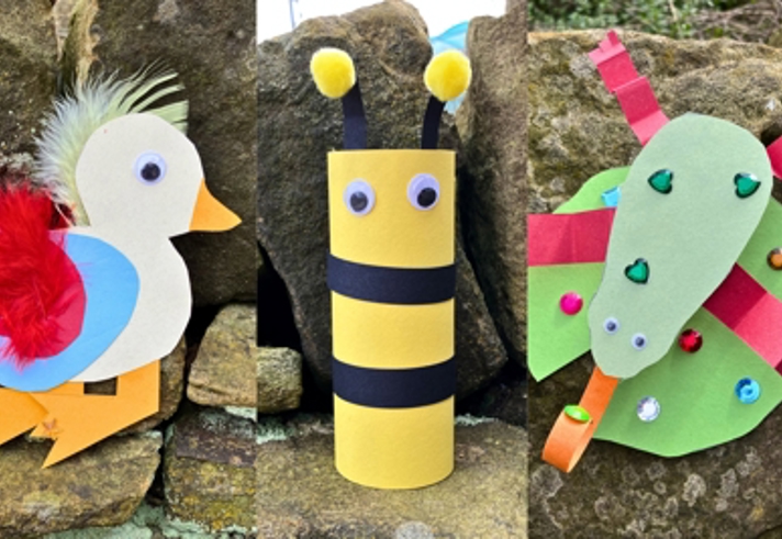 A photo collage showing three colourful children’s craft animals made from paper and recycled materials, displayed outdoors against stone rocks. On the left is a white bird with a yellow beak, red feathered wing, blue circle body detail, and orange legs. In the centre is a yellow and black striped bee made from a cardboard tube, with two googly eyes and two yellow pom‑pom antennae. On the right is a green bug made from layered paper shapes with red stripes, decorated with sequins and a long green paper head