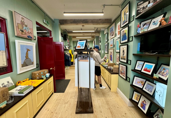 The interior of McKee Gallery, with the walls lines with prints for sale.