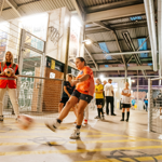 Children playing football at Yard Ball, an indoor football park.