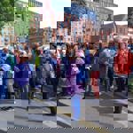 A group of people on a city centre tour in Sheffield.