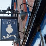 The pub sign hanging outside The Fat Cat.