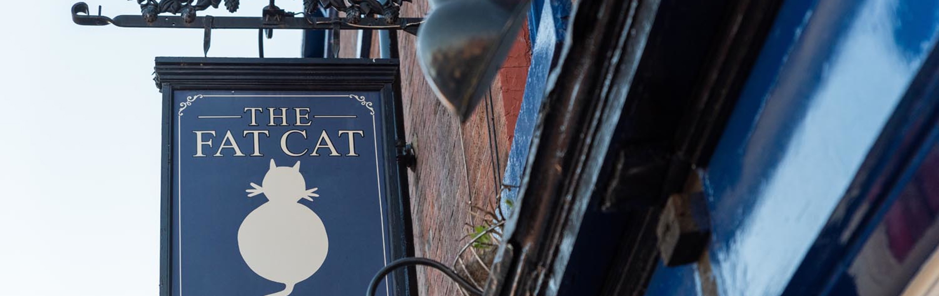 The pub sign hanging outside The Fat Cat.