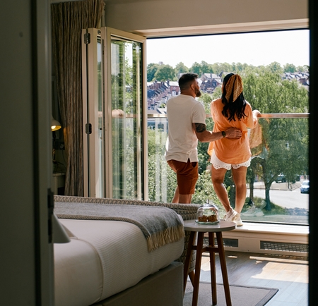 Couple admiring the view from Brocco on the Park a boutique hotel in Sheffield
