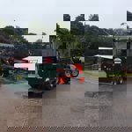 A tractor pulling a small carriage at Whirlow Hall Farm.