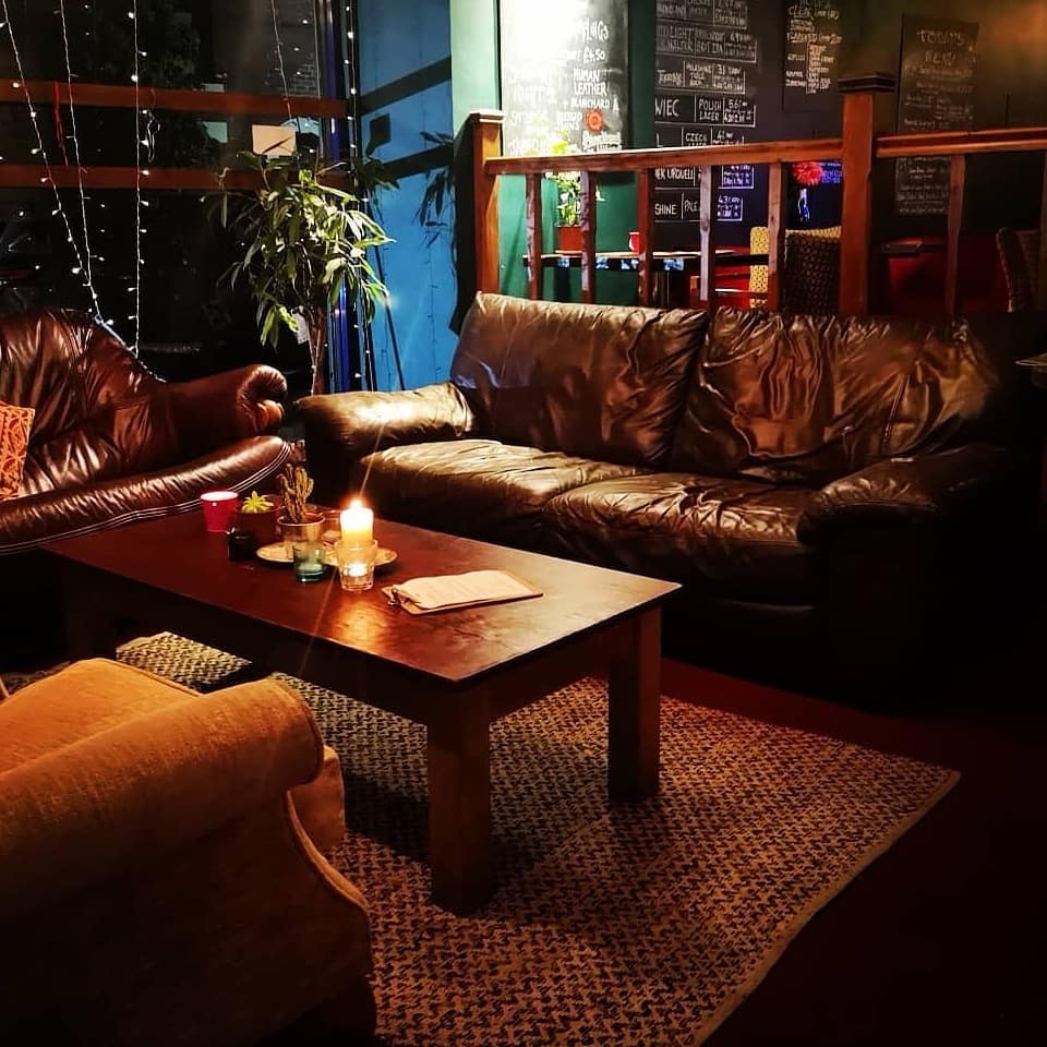 Comfortable sofas and chairs arranged around a low table at Jabbarwocky.