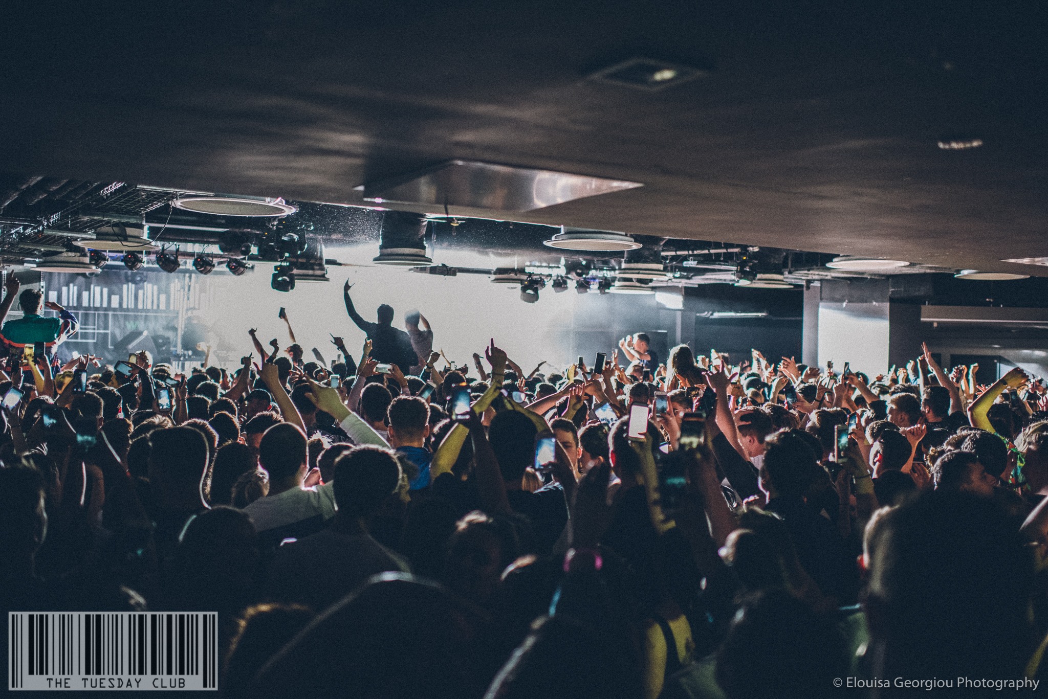 A band plays live at The Foundry. The venue is packed and everyone is dancing.