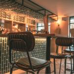 A high table with bar stools at The Dark Horse.
