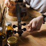 Emma Hardy from Hardy Violins stringing a violin.