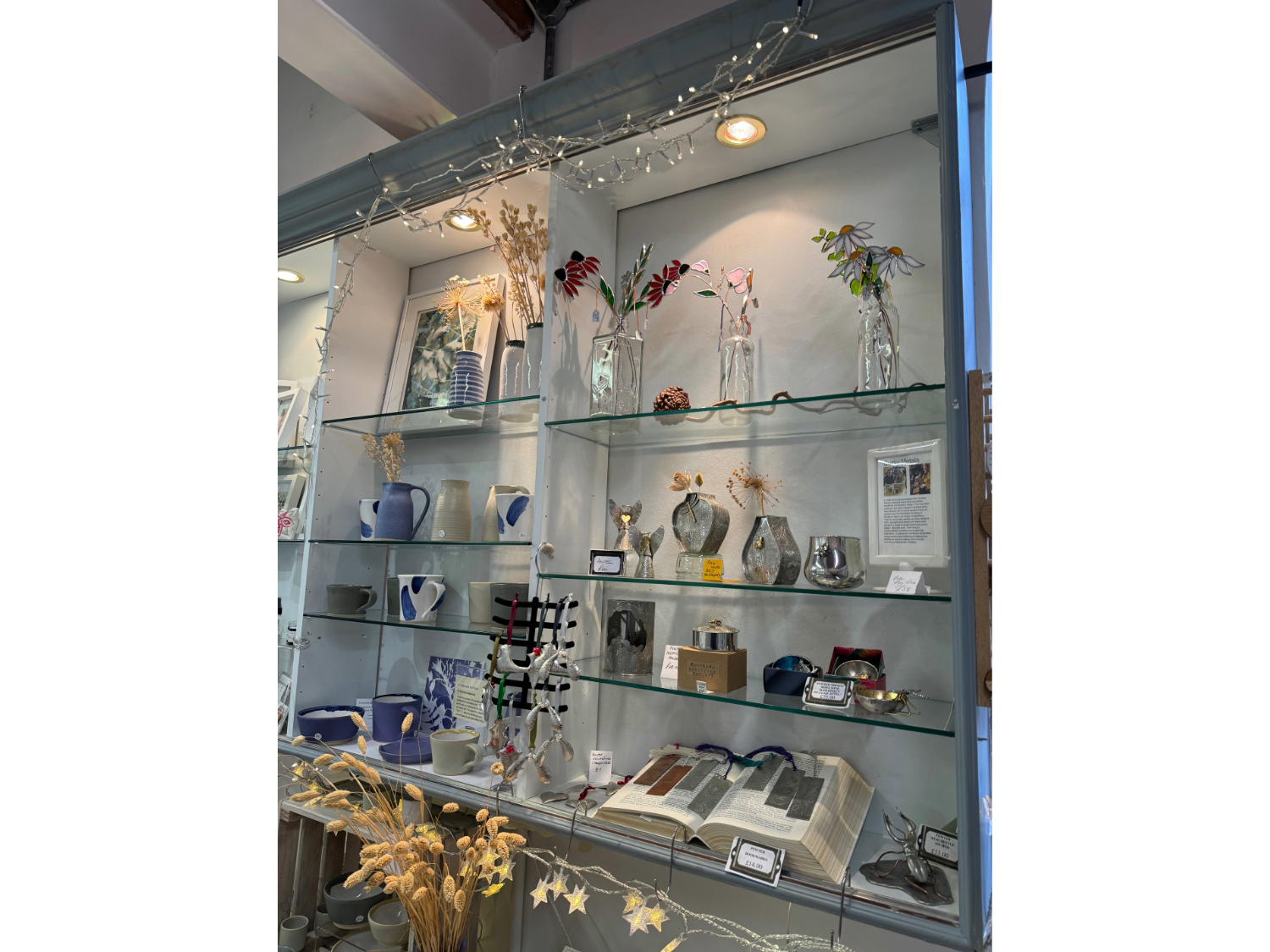 Shelving filled with home wares for sale at All Good Stuff.