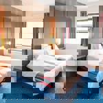 Interior of a twin room at Travelodge Sheffield Meadowhall with two single beds and modern furnishings.