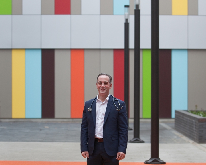 Paul Dimitri standing in a courtyard at the Sheffield Childrens Hospital.