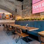 The interior of Tavern On The Quays with its bare stone walls and vaulted ceiling. 