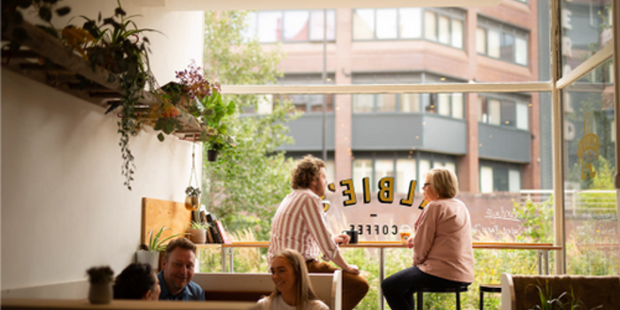 People sat inside Albie's Coffee.