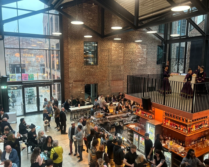 Inside Cambridge Street Collective, filled with people eating and drinking.