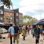 People strolling around the stalls at Rex Market.