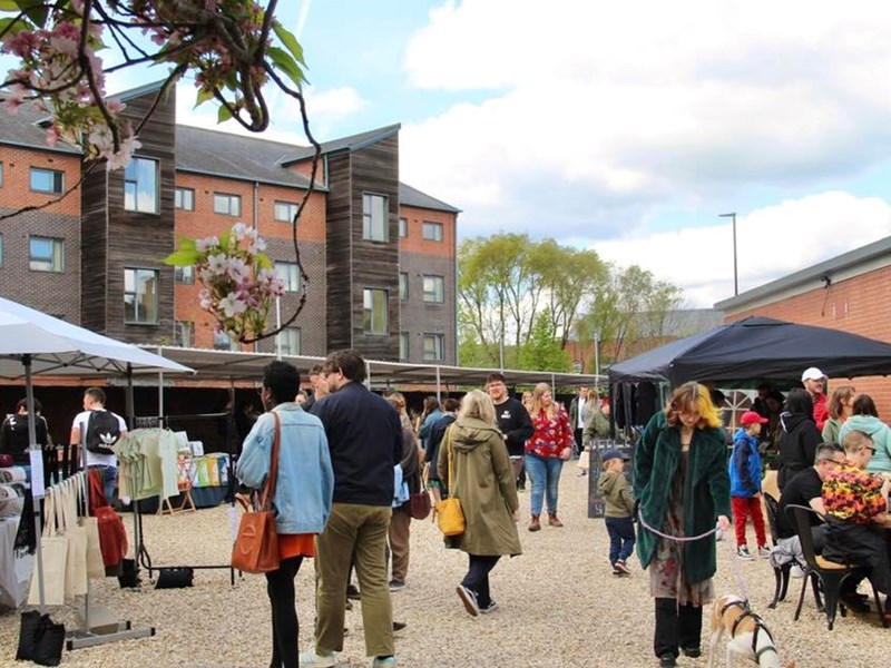 People strolling around the stalls at Rex Market.