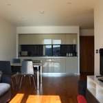 Living area with compact kitchen at Homely Serviced Apartments – St. Paul’s.