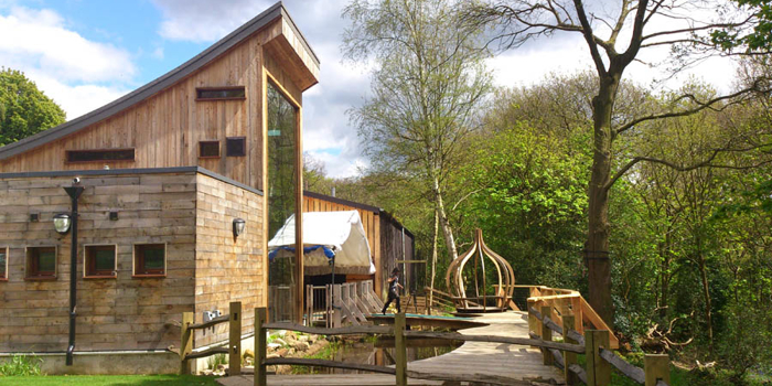 Stone and wood buildings at the J.G. Graves Woodland Discovery Centre.