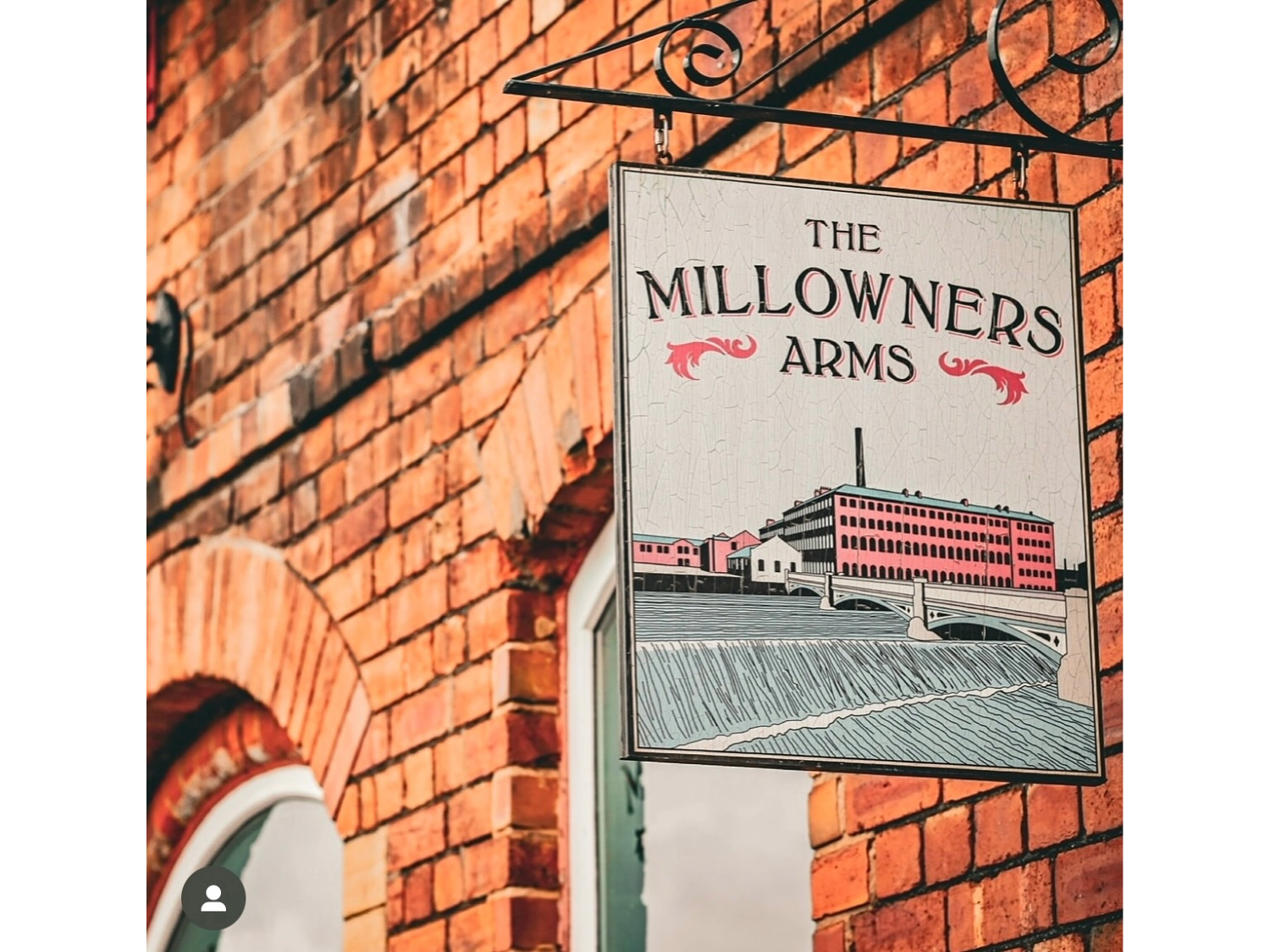 The sign hanging outside The Millowners Arms.