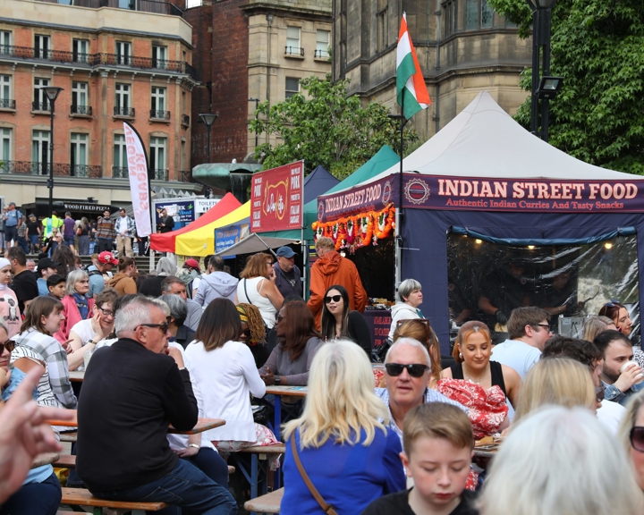 The Peace Gardens, the centre of Sheffield, is filled with people and pop-up stalls. The Sheffield Food Festival is in full swing.