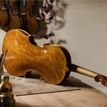 A violin on a workbench at Hardy Violins.
