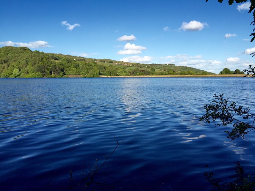 blue skies reflecting on the water at Agden Reservoir