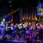 The orchestra, on stage, from a previous Christmas Festival Of Music.