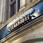 The Miller & Carter Steakhouse sign above the entrance to the restaurant.