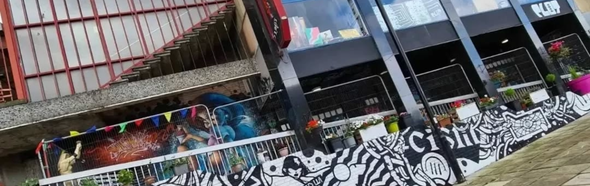 Exterior of Plot 22, which is decorated by several murals.