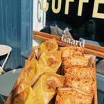 Baked goods on a wooden tray at Gaard Coffee Hide.