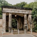 Entrance to a cemetery with stone pillars