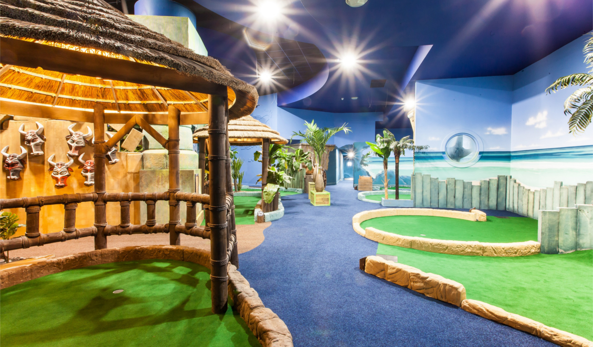 An indoor crazy golf course.