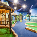 An indoor crazy golf course.