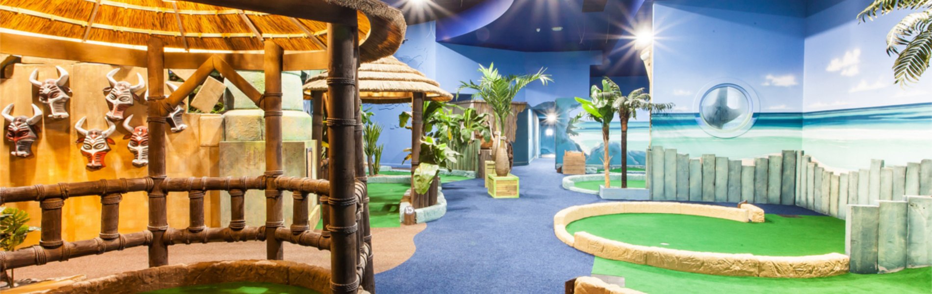 An indoor crazy golf course.