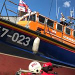 A life boat on exhibit at a museum.