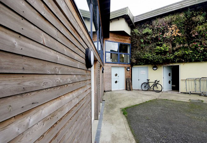 The exterior of Manor Oaks Studios.