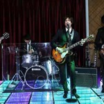 A band playing on a stage.