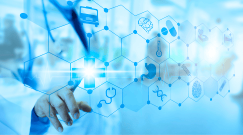 A healthcare-themed graphic with a blue color scheme showing a hand touching a glowing medical cross icon on a hexagonal grid. The grid contains various medical symbols, including a brain, pills, thermometer, stomach, and DNA strand, representing different aspects of health and medicine.
