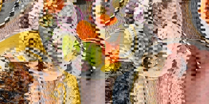 Plates of fresh Turkish food laid out on a table.