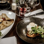 A meal for two laid out on a table at Inox Dine.